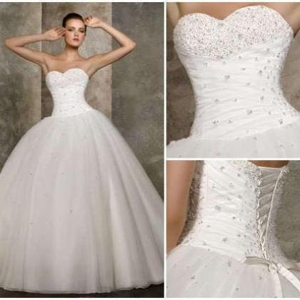 Strapless Sweetheart Ruched Beaded Ball Gown..